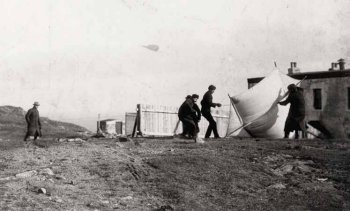Marconi and his assistants launching the kite-supported 
        aerial at Signal Hill, December 1901