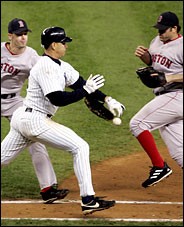 Terror at First Base:  Yankee base runner slapping a ball out of a Red Sox pitcher's glove